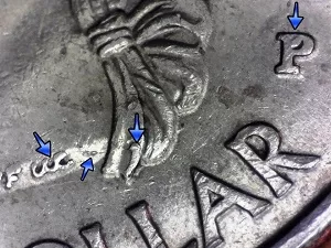 2009 Guam Quarter obverse error with arrows noting the filled P