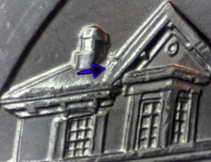 Die chips create the snowy roof appearance on a national park quarter