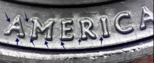 microscopic view of arrows noting doubling errors in America on the reverse of a 2020 bat quarter