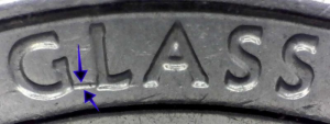 microscopic image of district of columbia quarter with a die gouge