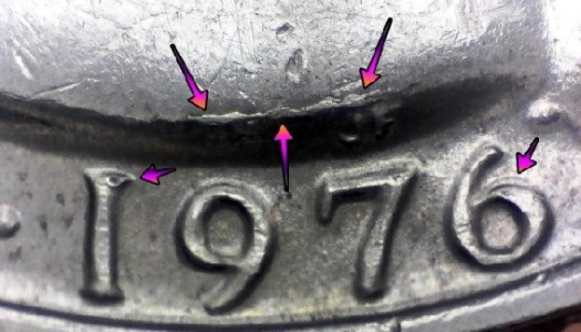 image of arrow noting a die crack error on the obverse of 1776 1976 american quarter