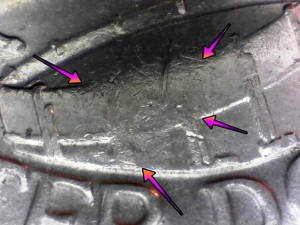 microscopic image a common error displaying in the center of the drum on the drummer boy quarter dollar coin
