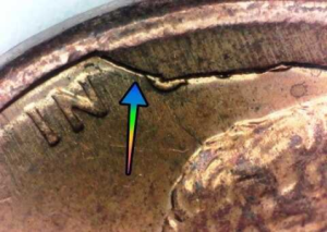 microscopic up close image of a cud error on a 1989 penny obverse