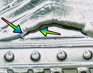Microscopic image of Anna May Wong quarter error with arrows noting the die break error