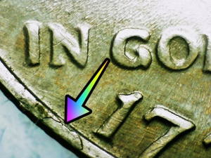 microscopic image of a rim cud on kennedy half dollars