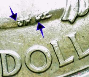 up close image of die chip error on the obverse of a 2006 state quarter worth money
