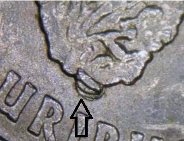 image of a 2009 Guam State Quarter reverse with an arrow noting the die chip error