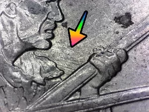 microscopic image of a feeder finger error coin