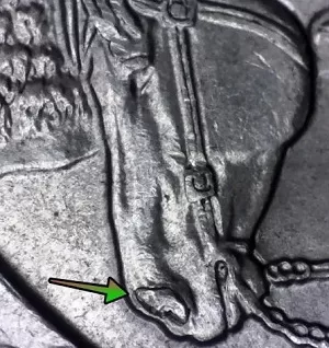 microscopic image of arrow noting an error on the nose of the horse showing on the reverse of a 2016 North Dakota Quarter