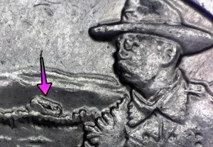microscopic image of arrow noting an error on tree line showing on the reverse of a 2016 Roosevelt Quarter