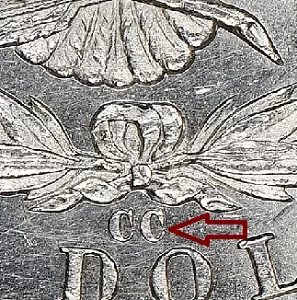 microscopic view of the 'CC' mint mark on a 1889 Morgan Dollar