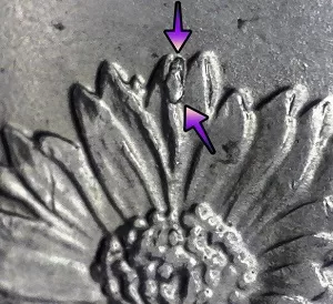 up close image of an error displaying on 2008 Oklahoma Quarter Dollar Coin reverse with a die chip on the flower