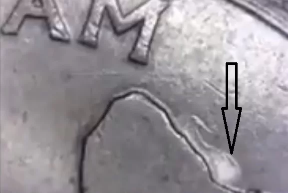 up close of the error on a 2009 Guam quarter reverse